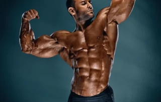 Bodybuilder in front flex double biceps pose